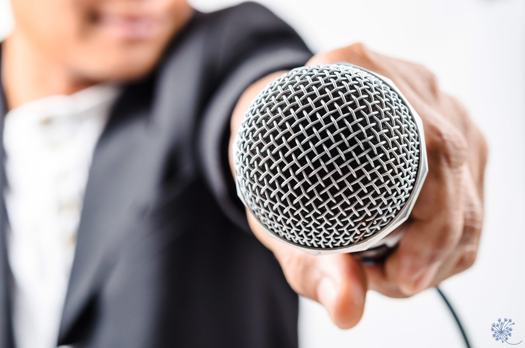 Artist holding out microphone