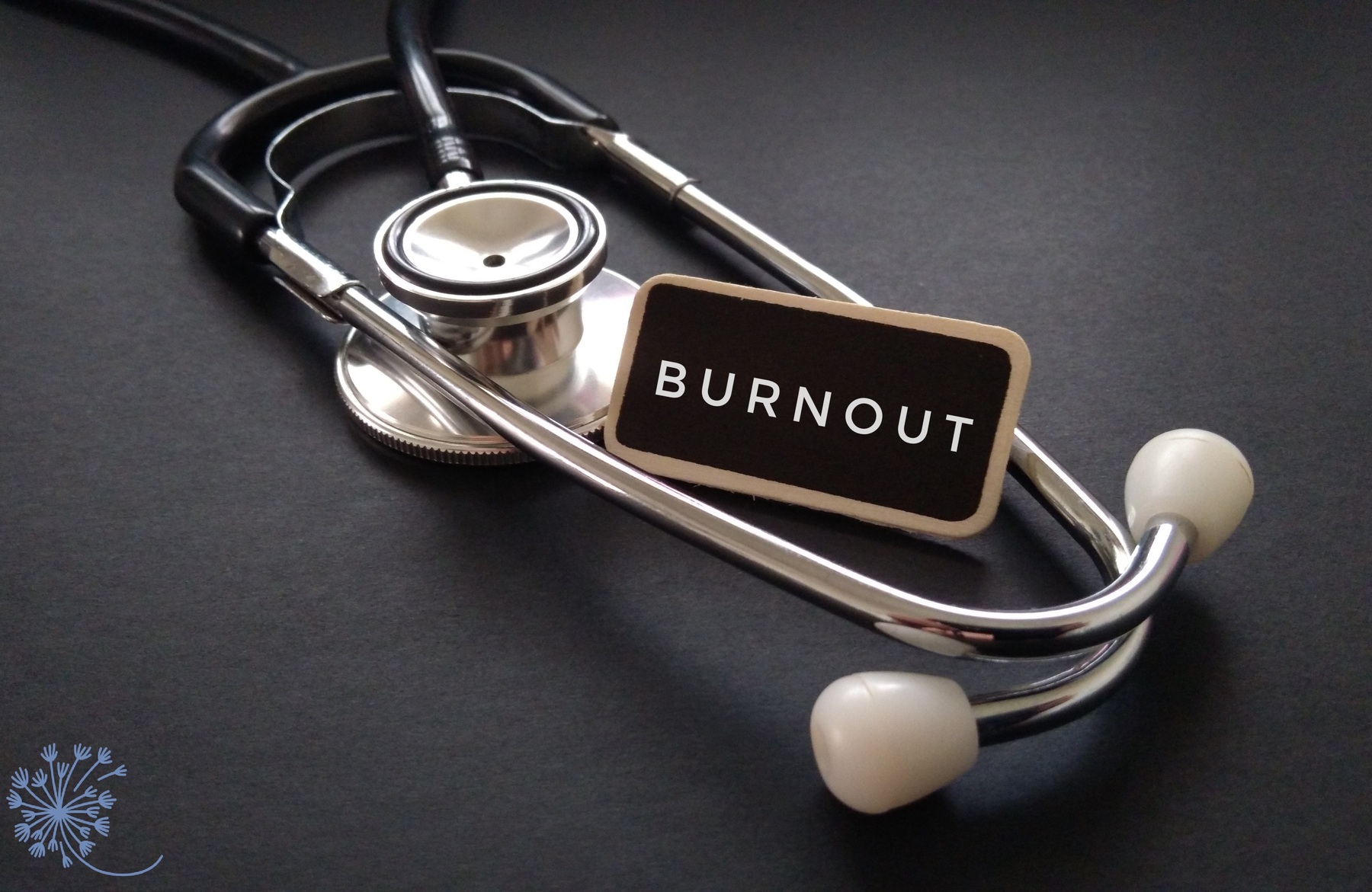 A stethoscope with the word burnout