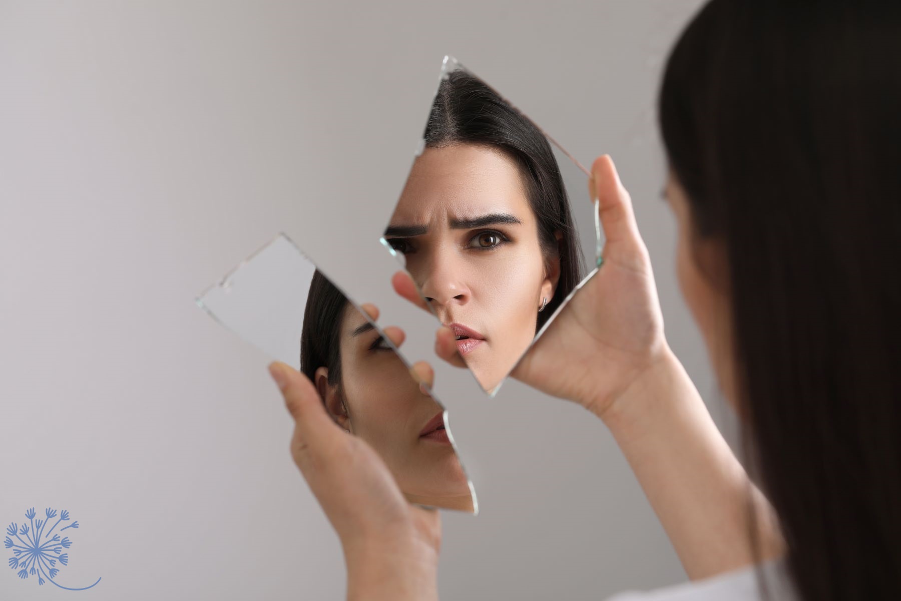 Person seeing parts of self in a mirror